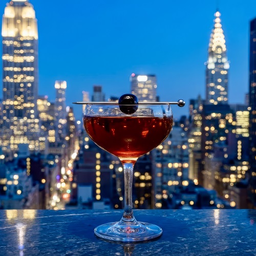 Classic Manhattan cocktail in a coupe glass,garnished with a cherry
